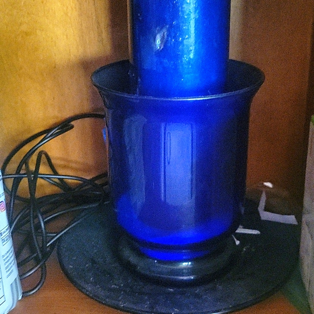 Blue candle with vase and plate and sand never opened. Its a collectible.